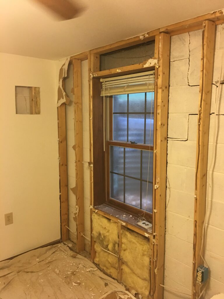 Window surrounded by cracks in a home