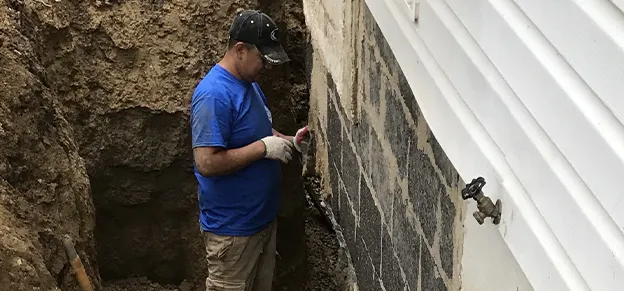 Foundation Medix doing foundation repair on a house in Alexandria, VA